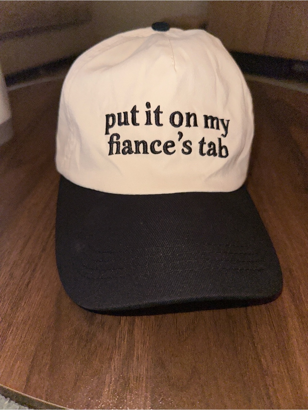 White and Black Baseball Cap with 'put it on my fiance's tab' Embroidery